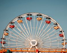 a large ferris wheel sitting on top of a field