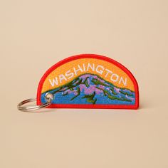 3.5" width x 1.731" height Double-sided embroidered keychain with a key ring. Embroidery Floss Keychain Patterns, Patch Keychain, Keychain Embroidery, Thesis Ideas, Teacher Portfolio, Brand Merchandise, Mt Rainier, Cotton Labels, Key Tags