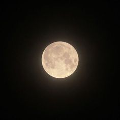 the full moon is seen in the dark sky