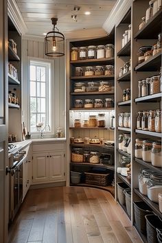 a kitchen with lots of shelves filled with food