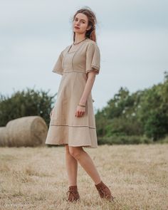 Harvest Dress We are currently waiting the arrival of a new production of this dress. Orders will be shipped after July 11th. This folk inspired dress is constructed of 100% cotton jute which has a beautiful traditional weave. The fabric is similar to linen and has a crisp solid feel. This dress is not dyed and the colours seen are the natural colours of the plant spun in to thread. Super comfortable to wear, perfect for summer days. It also makes a great layer over leggings for cooler days. Sma Cottagecore Linen Dress For Garden Party, Brown Cottagecore Dress For Summer, Bohemian Beige Cotton Midi Dress, Beige Bohemian Cotton Midi Dress, Spring Cottagecore Linen Dress, Spring Bohemian Beige Linen Dress, Spring Beige Bohemian Linen Dress, Spring Beige Linen Bohemian Dress, Cottagecore Short Sleeve Midi Dress