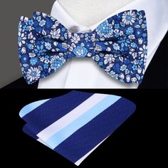 Blooms of Elegance: The Shades of Blue and White Floral Silk Bow Tie A Garden of Style Blooms in Every Knot In the world of men's fashion, a bow tie is not just an accessory; it's an emblem of style and individuality. Our Shades of Blue and White Floral Silk Bow Tie transcends traditional boundaries, offering a garden of intricate flowers that tell a story of elegance and sophistication. In this blog post, we immerse ourselves in the details of this silk masterpiece, exploring styling options, p Blue Summer Bow Tie For Business, Blue Bow Tie For Summer Business Events, Blue Bow Tie For Father's Day, Blue Standard Bow Tie For Father's Day, Blue Bow Tie With Bow Tie Back For Groom, Blue Dapper Bow Tie For Summer, Dapper Blue Bow Tie For Summer, Classic Blue Tie With Butterfly Knot, Summer Blue Bow Tie And Accessories