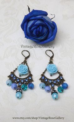 Light Blue Chandelier Earrings, Blue Bohemian Earrings, Boho Artistic Earrings, Chandelier Bohemian Earrings A bohemian pair of light  blue chandelier  earrings !!!Features light  blue tiny rhinestones ,  Czech crystal beads , antique bronze findings  , light blue resin  rose beads and antique bronze lever backs .The most  interesting , joyful, impressive, artistic and light BLUE earrings !!!! Measures approx. 2.50  " - 7 cm in length. 🌹Select  from VintageRoseGallery as many items as you like Blue Bohemian Flower Earrings For Party, Affordable Blue Bohemian Chandelier Earrings, Bohemian Blue Earrings For Party, Blue Bohemian Chandelier Earrings For Party, Vintage Dangle Flower Earrings For Party, Bohemian Blue Chandelier Earrings As Gift, Bohemian Turquoise Chandelier Earrings For Party, Turquoise Bohemian Chandelier Earrings For Party, Blue Bohemian Earrings For Pierced Ears