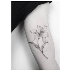 a black and white photo of a flower on the left arm, with an arrow in the center