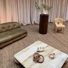 a living room with two couches and a coffee table in the middle on carpeted flooring