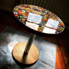 a table with buttons on it sitting on top of a blue mat next to a radiator