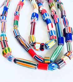 "You will receive: Artisan handcrafted assortment Ethnic African & Nepalese rare Glass beads. Mix Shapes, sizes & colors glass chevron beads. Very Unique, you'll love them! Sold by strand 15\" by strand random size and shapes Random Size from : 6-40mm Approx hole from: 1-3mm Please select qty at drop box Contact me if you need larger quantity. *Please note these are hanmade beads, not close to perfect, they are unique and rare some are raw cut and unpolished*" Artisan Multicolor Oval Beaded Necklaces, Artisan Multicolor Beads For Gifts, Eclectic Multicolor Beads For Jewelry Making, Artisan Multicolor Czech Glass Beaded Necklaces, Multicolor Polished Beads For Crafting, Handmade Bohemian Assorted Necklaces, Bohemian Assorted Beads For Gifts, Multicolor Large Beads For Crafting, Handmade Bohemian Murano Glass Beaded Necklaces