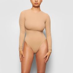 Our classic crew neck long sleeve bodysuit updated in lightweight, buttery soft fabric that hugs your curves. An essential styling piece to add to your ... High Neck Bodysuit, Scoop Neck Bodysuit, Square Neck Bodysuit, Sleeveless Bodysuit, Size 16 Dresses, Long Sleeve Bodysuit, High Cut, Light Brown, Nordstrom