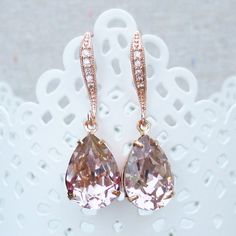 "Heatherly Designs dangling earrings made using genuine Swarovski® crystals in blush pink which dangle from rose gold plated brass french earring hooks with tiny inlaid cubic zirconia. ●Nickel free ●Earring Size (L x W): 1.25\" x 1/2\" or 32 x 14mm ●Swarovski® crystal color name(s): Vintage Rose ●Matching Necklace: http://etsy.me/1Og9wYm ●Arrives in our signature Heatherly gift box. Handmade with ❤ by Heather ● ● ● ● ● ● ● ● ● ● ● ● ● ● ● ● ● ● ● ● ● ● ● ● ● ● ● ● →Quantity Discounts listed belo Rose Gold Drop Crystal Earrings For Wedding, Pink Drop Crystal Earrings For Wedding, Pink Cubic Zirconia Crystal Earrings For Wedding, Rose Gold Dangle Crystal Earrings For Wedding, Sparkling Rose Gold Crystal Earrings For Wedding, Pink Sparkling Crystal Earrings For Wedding, Sparkling Rose Gold Crystal Wedding Earrings, Wedding Pink Sparkling Crystal Earrings, Rose Gold Pear-shaped Teardrop Earrings For Wedding