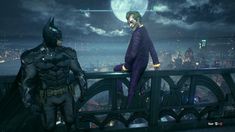 two batmans standing on top of a bridge at night