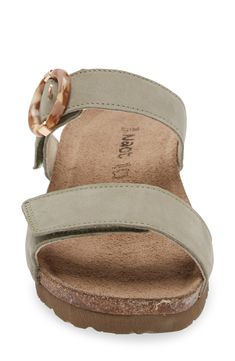 A rounded buckle stands out at the strap of a summery sandal set on a walkable wedge for everyday comfort and style. 1 1/4" heel (size 39) Adjustable hook-and-loop straps Cushioned footbed with arch support Leather upper and lining/synthetic sole Imported Casual Wedge Sandals With Double Adjustable Strap, Casual Double Strap Wedge Sandals With Adjustable Strap, Casual Wedge Sandals With Double Strap, Casual Double Strap Wedge Sandals With Heel Strap, Wedge Sandals With Adjustable Strap And Round Toe, Casual Adjustable Wedge Heel Footbed Sandals, Everyday Sandals With Buckle Closure And Round Toe, Casual Wedge Sandals With Buckle And Single Toe Strap, Casual Sandals With Buckle Closure For Everyday Use