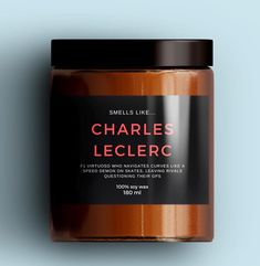 a jar of charles leclerc on a blue background with the label in red