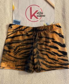 a pair of brown and black tiger print shorts