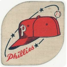 a baseball cap with the word phillies on it and a ball coming out of it