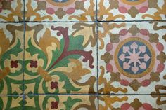 colorful tiles with designs on them in different colors