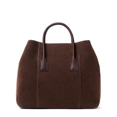 Practical and stylish, this mini weekender bag is ideal for an overnight getaway or for times when a roomy handbag is required on a busy day. Expertly made to the highest standards in Florence, Italy, it has shoulder straps or a longer detachable strap can be used for ease of transport. Suede Inside pocket Dimensions: 13.6"l x 6.7"w x 11.4"h Comes in a protective dust bag Made in Italy Care instructions: Only clean with a dry brush or dry cloth | AERIN Suede Mini Weekender in Chocolate/Brown siz Aerin Lauder, Dry Brush, Candle Accessories, Florence Italy, Luxury Gifts, Leather Mini, Nappa Leather, Weekender Bag, Leather Handle