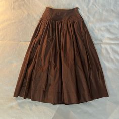 Vintage Saint Laurent Rive Gauche Brown Cotton Skirt. This Is A Full Midi Length Skirt (Full Length On A Short Frame) With A Yoke And Full Pleated Skirt. It Is Lined With Brown Rayon Skirting To Help Support The Shape And Fullness. A Beautiful True Vintage Designer Piece In Size 38, Which Correlates To An Extra Small. Measurements (Laying Flat): Waist 12” Yoke 16” Length 35” Lined Voluminous Wrap Skirt, Formal Flared Cotton Skirt, Formal Cotton Flared Skirt, Daywear Lined Wrap Skirt, Fitted Skirt With Pleated Waist For Daywear, Fitted Pleated Waist Skirt For Daywear, Traditional Full Gathered Skirt, Vintage Long Pleated Skirt, Traditional Fitted Skirt With Gathered Details