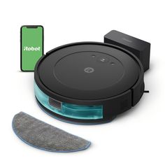 the robot vacuum is next to a cleaning cloth