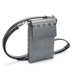 "Stay on the move with our pewter mobile bag. Small, lightweight and structured, the mobile bag rectangular design is perfectly suited for the everyday essentials...Keys, Wallet, Cell phone! Wear it as a crossbody, over the shoulder or even as a waist bag, this slim and sturdy cell phone bag will keep you on the go. Thoughtfully crafted and hand-riveted using durable, sustainably sourced, vegan leather and suedes in the USA. Each bag is made with love by an artist and an architect just for you. Modern Square Phone Bag For Everyday Use, Modern Rectangular Phone Bag For Everyday, Modern Rectangular Everyday Phone Bag, Rectangular Phone Bag With Cell Phone Pocket For Evening, Evening Crossbody Phone Bag With Cell Phone Pocket, Modern Square Phone Bag With Cell Phone Pocket, Modern Rectangular Phone Bag With Removable Pouch, Evening Rectangular Phone Bag With Cell Phone Pocket, Evening Phone Bag With Cell Phone Pocket