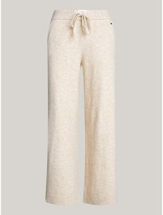 Tommy Hilfiger women's sleepwear. Nothing is better than lounging around in a pair of cozy, loose-fitting sweats—well, these were designed for just that. Made from a blend of nylon, acrylic and wool, woven in a jersey knit for a soft, subtle texture, our wide-leg lounge pant is made complete with an elastic drawstring waistband, pockets, and rib-knit hems.  Material: 47% Recycled Polyester, 33% Polyamide, 13% Acrylic. Cozy Winter Pants For Relaxation, Cozy Bottoms For Fall Relaxation, Cozy Bottoms For Relaxation In Fall, Cozy Fall Bottoms For Relaxation, Cozy Fall Relaxation Bottoms, Beige Sweatpants For Loungewear In Fall, Beige Sweatpants For Fall Loungewear, Cozy Sleep Bottoms With Soft Texture, Cozy Soft Sleep Bottoms