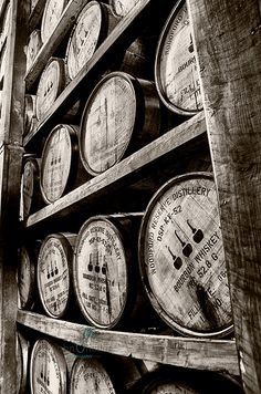 several wooden barrels stacked on top of each other