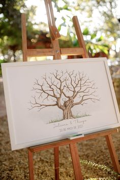 an easel with a tree on it