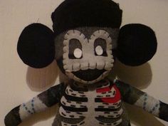 a stuffed animal with a skeleton on it's chest