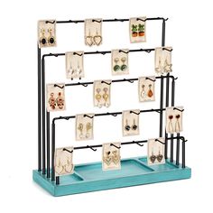 a rack with earrings and earring holders on it