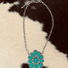 Boast your boho style with The Okley Necklace! Crafted with a turquoise blossom and shimmery chain, this beauty will have 'em doin' a double-take! So go ahead, flaunt it — you're sure to make a statement wherever you go! (And when the compliments come, graciously accept 'em, okley-dokley?) length: 11" extended chain: 3" Adjustable Turquoise Flower Pendant Jewelry, Bohemian Turquoise Flower Pendant Necklace, Double Take, Go Ahead, Boho Style, Boho Fashion, Blossom, Necklaces, Turquoise