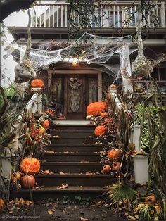 an entrance to a house decorated for halloween