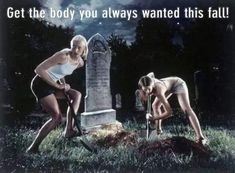 two women are digging in the grass near a grave