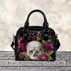 "► ABOUT THIS PURSE Colors: black, purple-violet Gorgeous Goth red-violet with skull, roses floral purse. Makes a great gift for yourself or anyone you love. The design is printed on both sides. The sides, bottom, handle and trim are black. * Manufactured with premium water-resistant PU vegan leather. * Features comfortable and sturdy carrying straps with high-quality stitching for long-lasting durability. * Includes an adjustable and removable shoulder strap. * Finished with multiple interior c Black Gothic Shoulder Bag, Black Gothic Tote Bag, Gothic Black Satchel, Gothic Skull Bag For Everyday Use, Gothic Black Shoulder Bag Gift, Black Gothic Shoulder Bag As Gift, Black Gothic Shoulder Bag For Gift, Halloween Skull Print Travel Bag, Alternative Style Black Satchel Bag