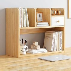 a wooden shelf with books and other items on it