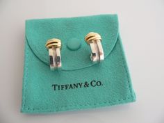 Overview: Time to pull your hair up and show off these gorgeous earrings! Offered for sale is a wonderful, very versatile, and rare pair of Tiffany & Co Sterling Silver and 18K Gold Atlas earrings. The pair is for pierced ears. Super classic pair that looks very pretty and feminine! I am 100% positive that you will want to use it over and over again. Your friends will be fascinated by this gorgeous piece – it is almost like a work of art - without the extremely high price! And because it is Designer Polished Finish Earrings For Anniversary, Designer White Gold Hoop Earrings For Gift, Designer Clip-on Earrings For Anniversary, Luxury Hallmarked Clip-on Earrings For Gift, Luxury Hallmarked Clip-on Earrings As Gift, Luxury Clip-on Hoop Earrings As Gift, Elegant Clip-on Huggie Earrings As Gift, Elegant Clip-on Huggie Earrings For Gift, Luxury Clip-on Huggie Earrings For Anniversary