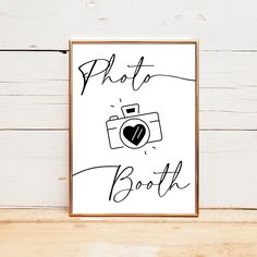 a black and white poster with the words photo booth written in cursive writing