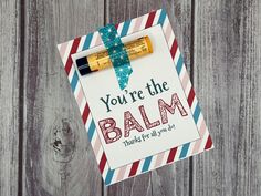 a card with an envelope and two pens on it that says, you're the balm