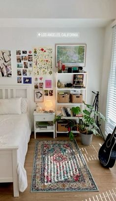 a bed room with a neatly made bed and a guitar