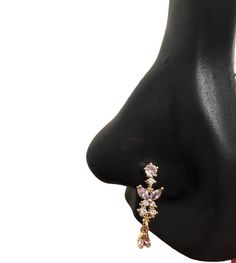 a woman's nose with an earring on it