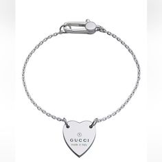 Product Description: A Timeless Design, This Bracelet Features A Heart Charm Engraved With The Gucci Trademark. Crafted From 925 Sterling Silver, The Jewelry Piece Reflects The House's Romantic Narrative. Product Highlights: * 925 Sterling Silver * Made In Italy Product Measurements: -Heart Pendant Length: 0.5 Inch -Heart Pendant Width: 0.6 Inch -Total Length Of Bracelet: 6.7 Inch Condition: This Item Is Brand New And Has Never Been Used. It Comes In Its Original Gucci Packaging 100% Authenticit Gucci Sterling Silver Jewelry With Heart Charm, Gucci Jewelry With Heart Charm As A Gift, Gucci Jewelry With Heart Charm, Gucci Designer Heart-shaped Jewelry, Gucci Sterling Silver Bracelet, Designer Gucci Heart-shaped Jewelry, Designer Heart-shaped Gucci Jewelry, Elegant Gucci Jewelry With Heart Charm, Gucci Elegant Heart Charm Jewelry