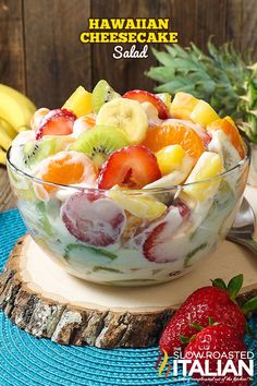 a fruit salad is served in a glass bowl