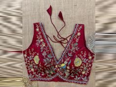 Shop maroon embroidered sleeveless saree blouse online in USA. Elevate your saree style with exquisite readymade saree blouses, embroidered saree blouses, Banarasi sari blouse, designer saree blouse, choli-cut blouses, corset blouses from Pure Elegance Indian fashion store in USA. Corset Blouses, Sleeveless Saree Blouse, Sleeveless Saree, Banarasi Sari, Sleeveless Blouse Saree, Designer Saree Blouse, Saree Blouses Online, Blouse Designer, Floral Mirror