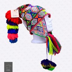 "FREE SHIPPING FREE SHIPPING An exquisitely and heavily hand-beaded Q'ero ch'ullo or hat. Hand knit of colorful wool and hand beaded with white glass beads. Embellished with multiple brightly colored tassels. This type of hat is worn by the Q'ero for special feast days and ceremonies. Peruvian Fair Trade. If laid flat, the Chullo alone is approximately 12\" long x 10.5\" wide. Including the pompoms on the bottom and all of the top, it measures from end to end 32\" approximately The Quechua word Festival Multicolor Beaded Hats, Multicolor Alpaca Bohemian Hats, Traditional Multicolor Beaded Hat, Multicolor Beaded Bohemian Hat, Bohemian Multicolor Handwoven Hat, Multicolor Knitted Festival Hat, Handmade Multicolor Festival Hats, Bohemian Multicolor Knitted Hat, Multicolor Bohemian Hats For Festivals