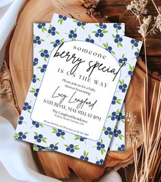 a blue and white floral themed birthday party card with the words, someone berry special is at the way