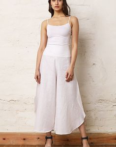 These stylish round hem flared trousers will help form a beautiful silhouette. Tailored in pure linen, it features elastic on the back waistline. Fitted Bottoms With Wide Hem For Summer, Fitted Linen Wide Leg Bottoms, Cotton Bottoms With Flared Hem For Summer, Summer Cotton Bottoms With Flared Hem, Stretch Linen Summer Pants, Fitted Linen Wide Leg Summer Pants, Chic Summer Pants With Flared Hem, Stretch Linen Ankle-length Bottoms, Fitted Linen Ankle-length Wide Leg Pants