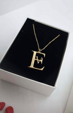 "celebrate your unique style? Look no further than this stunning 14K solid gold double letter name necklace! Crafted from premium-quality 14K gold, this minimalist initial necklace is the perfect way to show off your individuality and style. Whether you're looking to commemorate a special date, express your love for someone special, or simply add a touch of elegance to your everyday look, this customized couple jewelry is sure to impress. Featuring two delicate letters in a stylish cursive font, this personalized name necklace is a truly unique piece of jewelry. Whether you choose to wear it as a standalone piece or layer it with other necklaces for a more dramatic effect, it is guaranteed to make a statement. Perfect for gifting, this 14K solid gold double letter name necklace is an ideal Letter Name Necklace, Letter Necklace Initials, Gift For Anniversary, Fingerprint Jewelry, Cursive Font, Bracelets Gold Diamond, Couple Jewelry, Necklace Craft, Local Jewelry