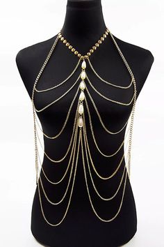 Stay hot this summer in the Adelynn Bikini Tassel Pearl Body Chain. This layered statement necklace features a gold-tone metal link base, drapey chain, and layered bib silhouette. Delicate pearls accent the center. It can be worn with a top tube dress or a bikini as an outfit. A summer body chain with a perfect sense of fashion, why not try it?One Size fits allColour may vary due to lighting on images Bralette Chain, Pearl Body Chain, Gold Body Chain, Gold Bodies, Gold Bead Necklace, Party Summer, Layered Chains, Perfect Sense, Chain Fashion