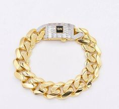 "17mm Miami Cuban Royal Link Plain Baguette Lock Bracelet Real 10K Yellow Gold * Metal : Real 10K Yellow Gold (Properly Stamped, 10K) * Condition : Brand New * Finish : Polished * Avg Weight : 29.20 gram * Length : Selectable * Width : 11/16\" = 17mm * Clasp/Bail : Baguette Box Clasp All of our items are brand new and are shipped with a gift box." Formal Cuban Link Bracelet With Diamond Accents In Gold, Luxury Gold Cuban Link Bracelet With Cubic Zirconia, Luxury Gold Diamond Cuban Link Bracelet, Gold Baguette Diamond Jewelry, Baguette Diamond Gold Jewelry, Luxury Cuban Link Curb Chain Bracelet For Anniversary, Luxury White Gold Bracelet With Curb Chain, Luxury White Gold Curb Chain Bracelet, Classic Gold Baguette Diamond Bracelet