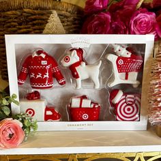 some red and white ornaments are in a box