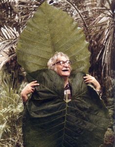 an older woman wearing a large leaf like costume