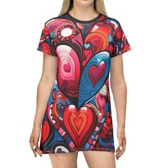 Dress in the language of love with our 'Hearts Symphony' All-Over-Print T-Shirt Dress by Amor4Life. This dress is not just an outfit; it's a celebration of vibrant love, adorned with a dazzling array of colorful hearts in different shapes and sizes, beautifully arranged in an artistic pattern. Crafted for those who believe in the power of love and embrace the joy of self-expression, our 'Hearts Symphony' T-Shirt Dress is the perfect addition to your wardrobe. The all-over-print design ensures that every inch of this dress is a canvas of love, creating a visual symphony that speaks to the heart. Let the language of love be your style statement with the 'Hearts Symphony' T-Shirt Dress. Elevate your wardrobe with Amor4Life's signature blend of comfort and artistic expression. Order yours now Multicolor Summer T-shirt With Heart Graphic, Summer Multicolor Heart Print T-shirt, Spring Multicolor Heart Print T-shirt, Casual Multicolor Heart Print T-shirt, Casual Multicolor T-shirt With Heart Print, Short Sleeve Multicolor Graphic Print Dress, Multicolor Graphic Print Short Sleeve Dress, Multicolor Graphic Print Crew Neck Dress, Multicolor Graphic Print Dress With Crew Neck